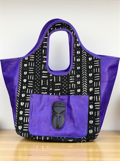 Royal Nomad Mudcloth Tote – Handmade in Mali with Purple Leather & Ebony Mask Accent (12x20x6)