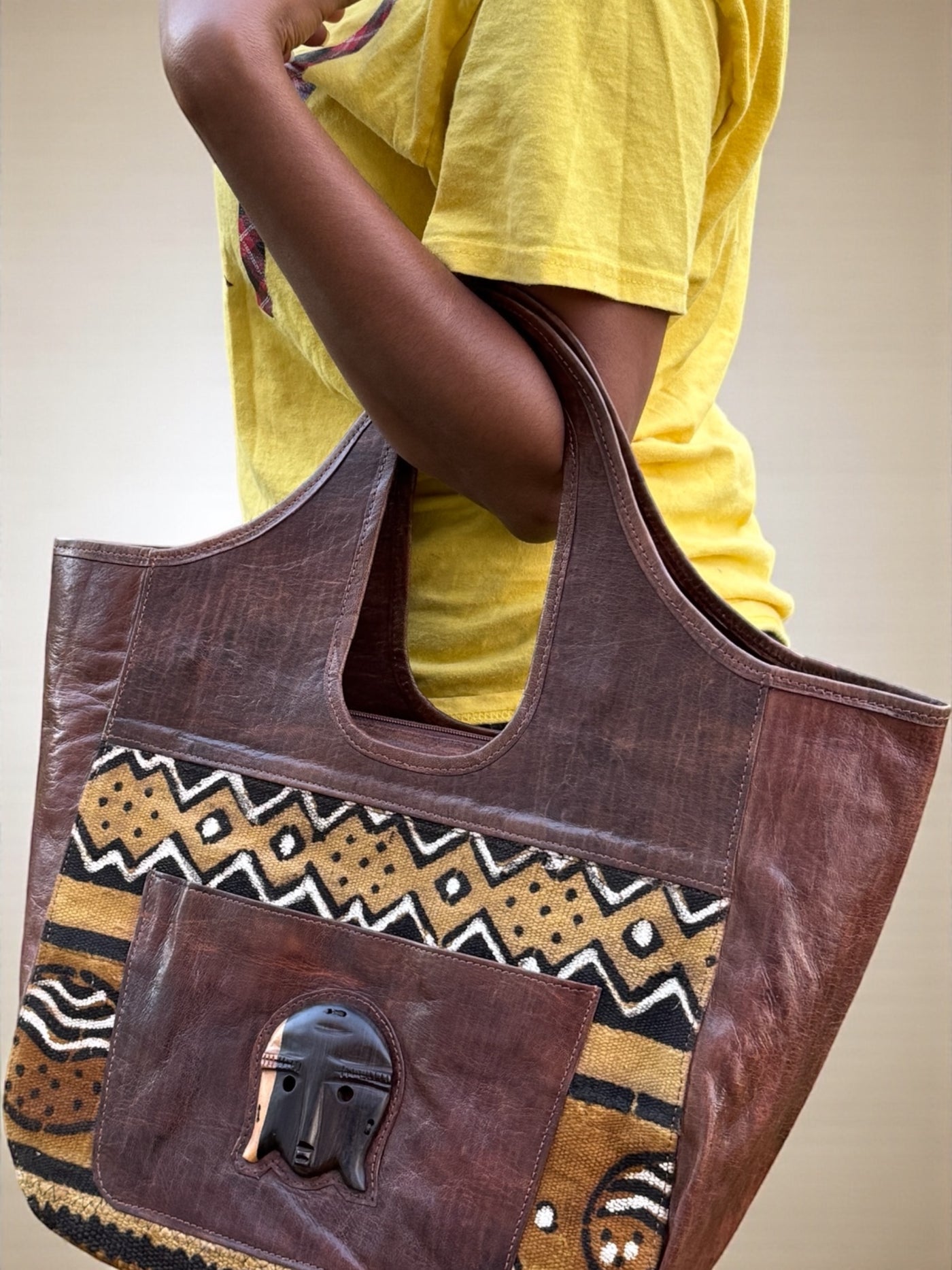 Savanna Spirit Mudcloth Tote – Handmade in Mali with Brown Leather & Ebony Mask Accent (12x20x6)