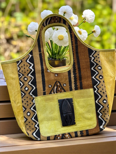 Golden Dune Mudcloth Tote – Handmade in Mali with Yellow Leather & Ebony Mask Accent (12x20x6)