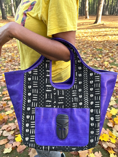 Royal Nomad Mudcloth Tote – Handmade in Mali with Purple Leather & Ebony Mask Accent (12x20x6)