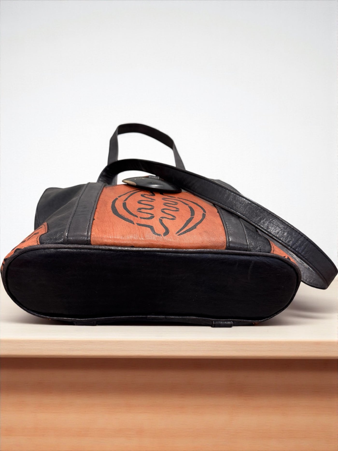 Ebony Harmony Leather Tote – Handcrafted in Mali with Adinkra Symbol Detail