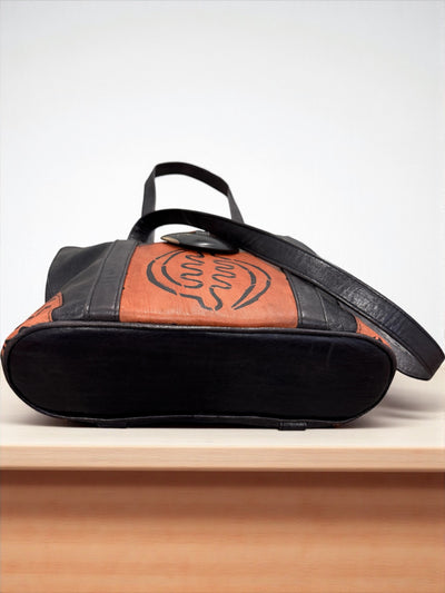 Ebony Harmony Leather Tote – Handcrafted in Mali with Adinkra Symbol Detail
