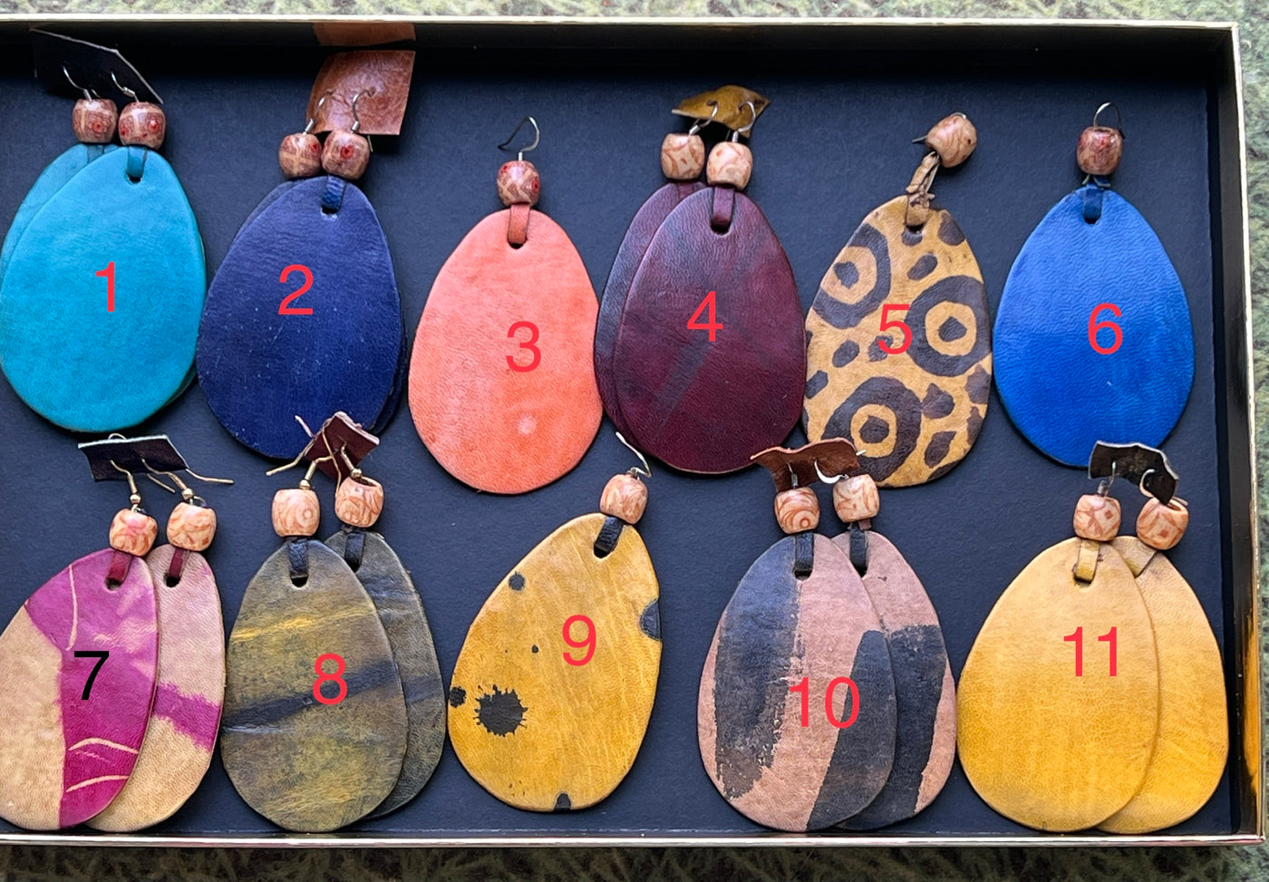 Oval Essence: Handmade Leather Earrings Inspired by Mali