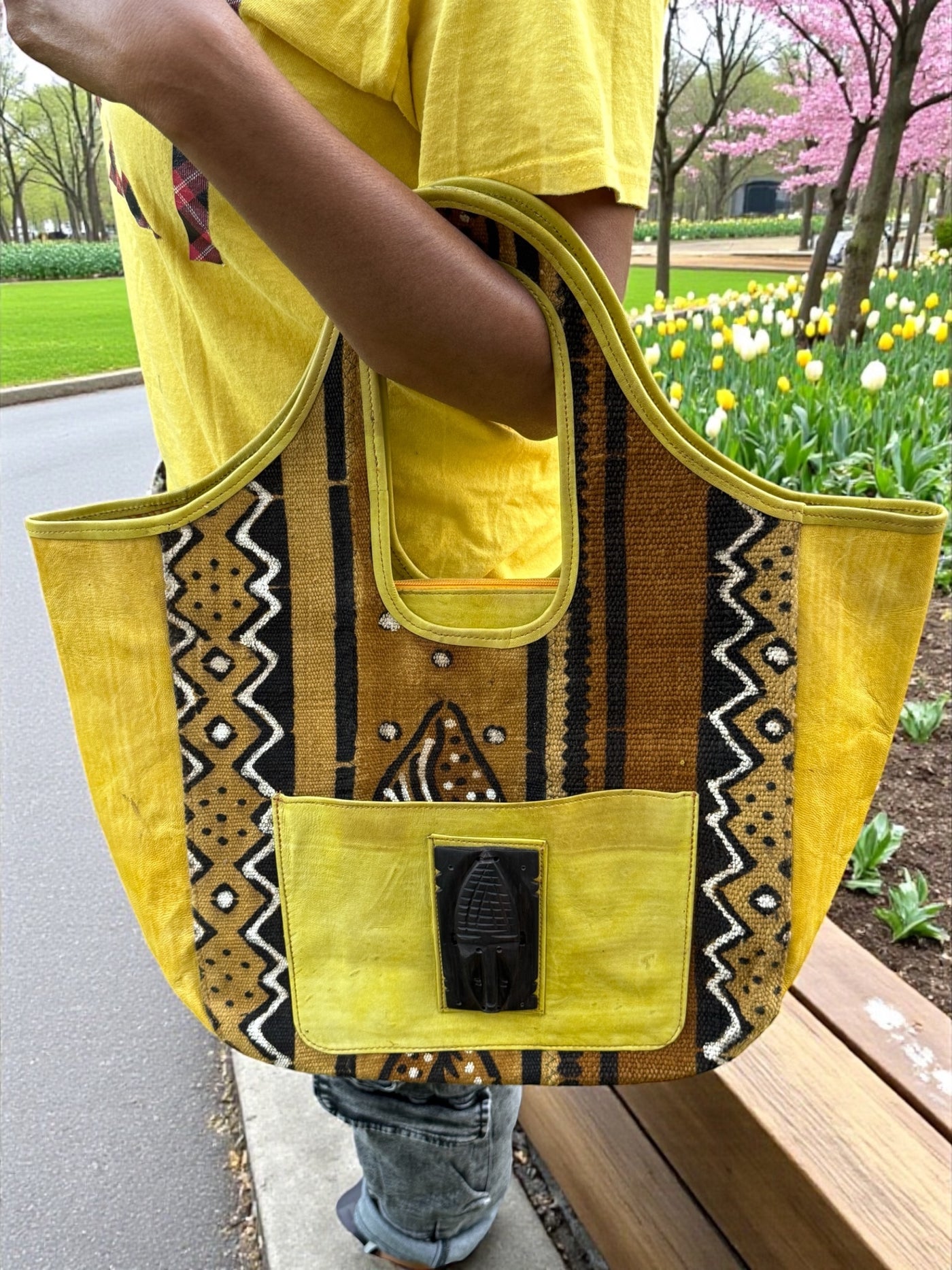 Golden Dune Mudcloth Tote – Handmade in Mali with Yellow Leather & Ebony Mask Accent (12x20x6)