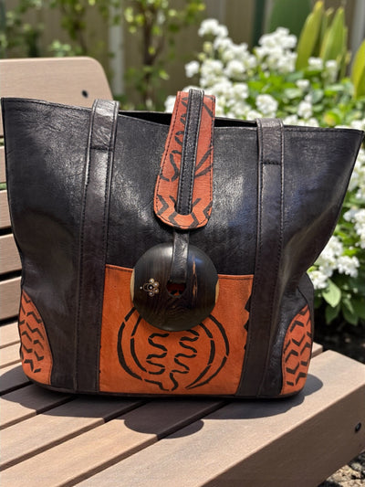 Ebony Harmony Leather Tote – Handcrafted in Mali with Adinkra Symbol Detail