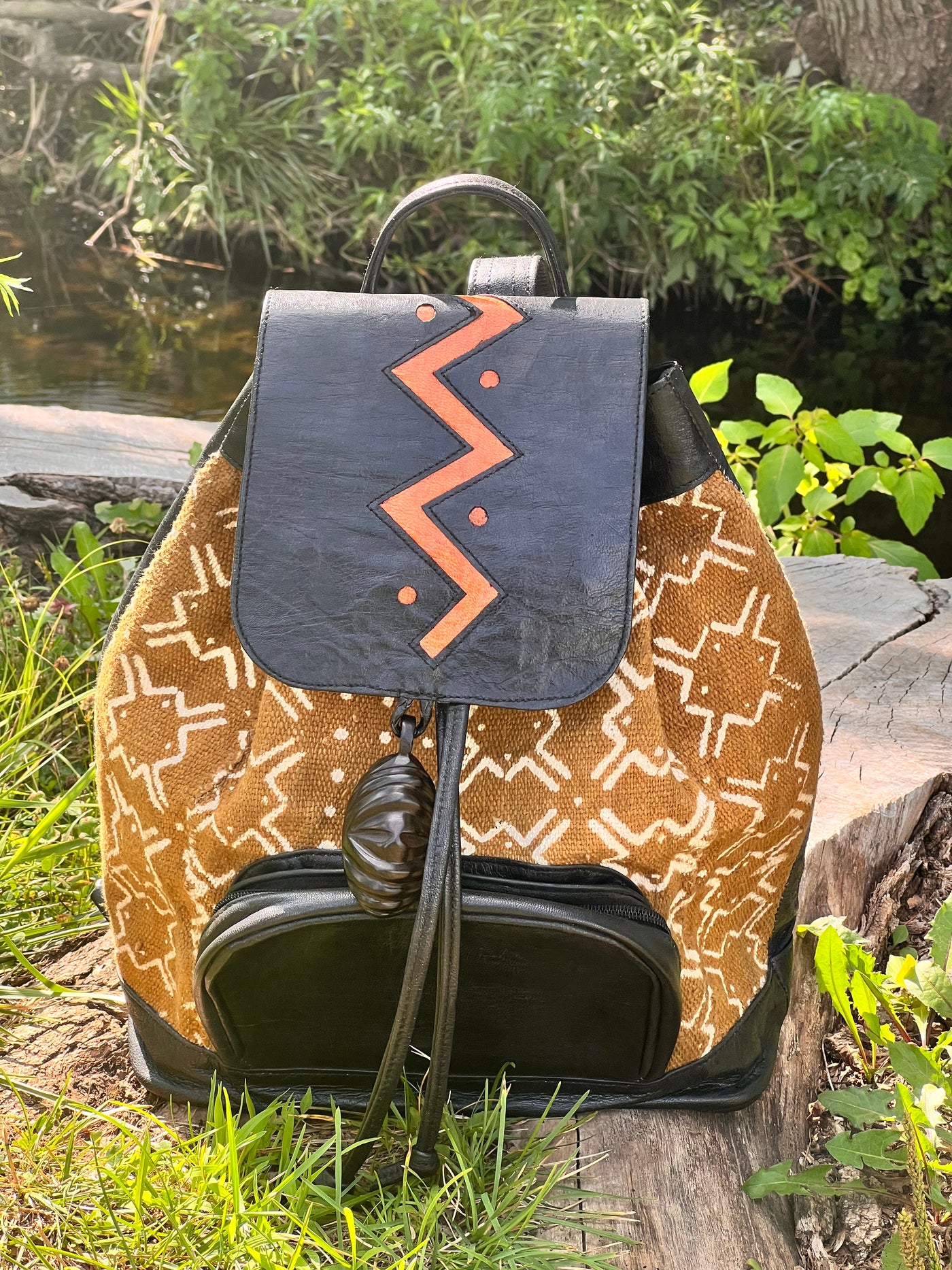 "Artisanal Midsize Leather Backpack with Malian Bogolanfini Fabric Accent"